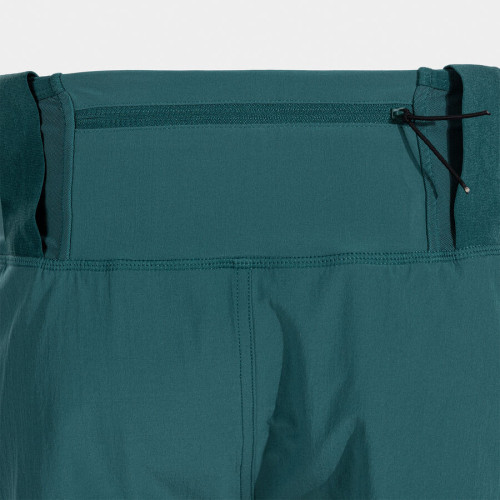 JOMA ICONIC SHORT TURQUESA PANTALONES TRAIL HOMBRE VISTA PORTA BASTONES, ARISTARUN