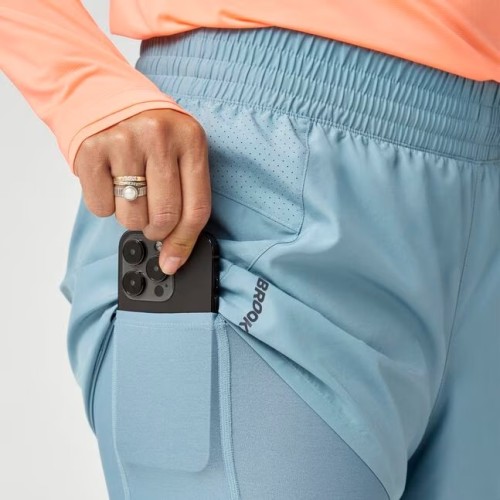 BROOKS DASH 2 IN 1 SHORT AZUL PANTALONES CORTOS MUJER VISTA BOLSILLO MALLA, ARISTARUN